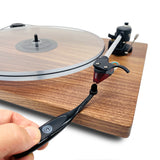 Turntable stylus being cleaned by GrooveWasher Record Cleaning Brush